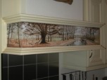 A cooker extractor unit illustrated with a New Forest scene